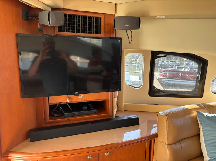 Kong Yacht Photos Pics Interior of 2005 Silverton 38 Sport Bridge with TV and sound system.