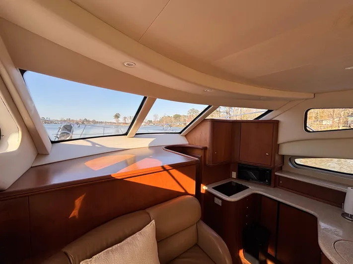 Kong Yacht Photos Pics Interior of 2005 Silverton 38 Sport Bridge yacht with panoramic windows and elegant wood finish.