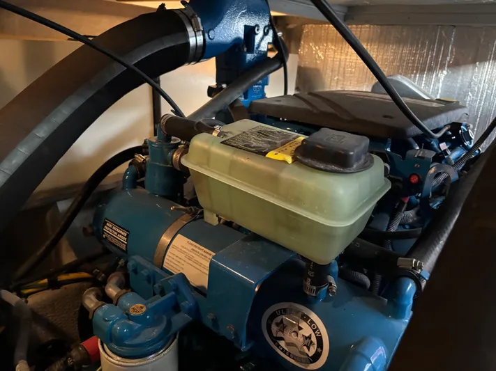 Kong Yacht Photos Pics Engine compartment of a 2005 Silverton 38 Sport Bridge boat, featuring mechanical components.