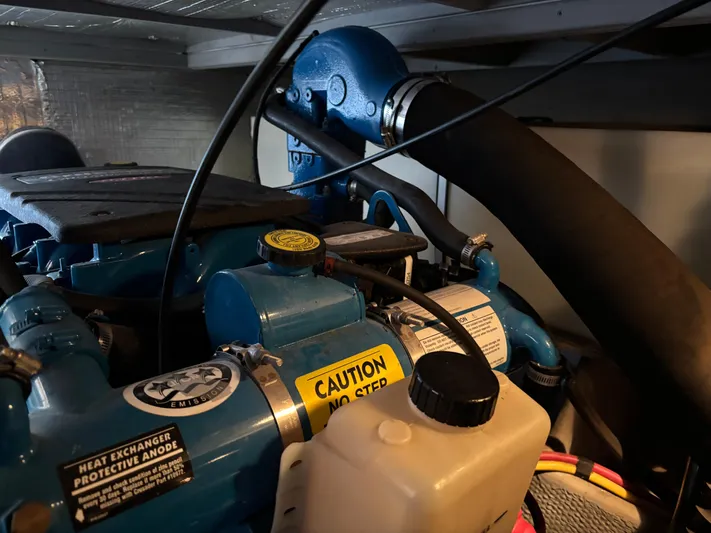 Kong Yacht Photos Pics Engine compartment of a 2005 Silverton 38 Sport Bridge with caution label.