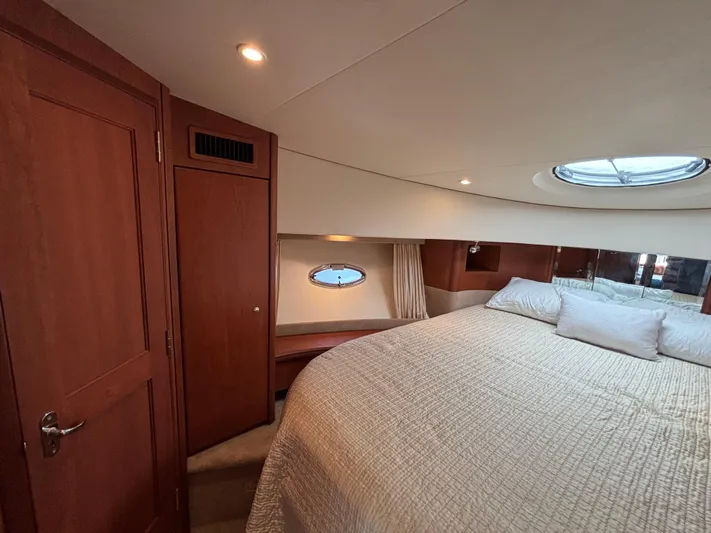 Kong Yacht Photos Pics Luxurious bedroom interior of 2005 Silverton 38 Sport Bridge yacht with cozy bedding.