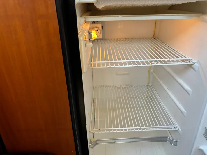 Kong Yacht Photos Pics Empty refrigerator inside a 2005 Silverton 38 Sport Bridge boat.