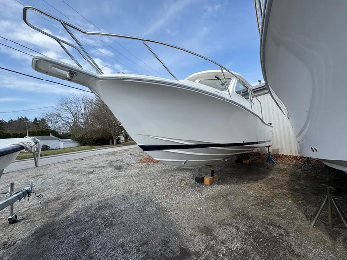  Yacht Photos Pics 2025 NorthCoast 255 HT boat on dry dock, side view under clear sky.
