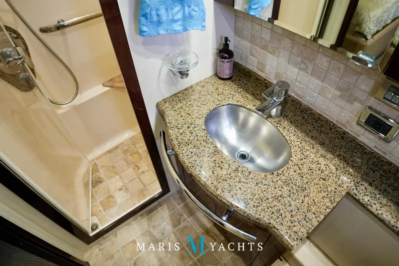 Man O War Yacht Photos Pics Luxurious bathroom in 2009 Sea Ray 55 Sundancer yacht with granite countertop and shower.