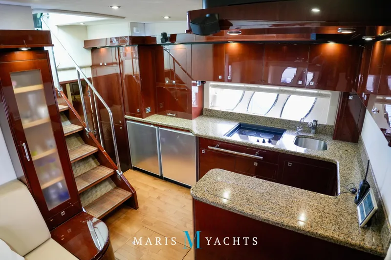 Man O War Yacht Photos Pics Luxurious kitchen interior of 2009 Sea Ray 55 Sundancer yacht with modern amenities.