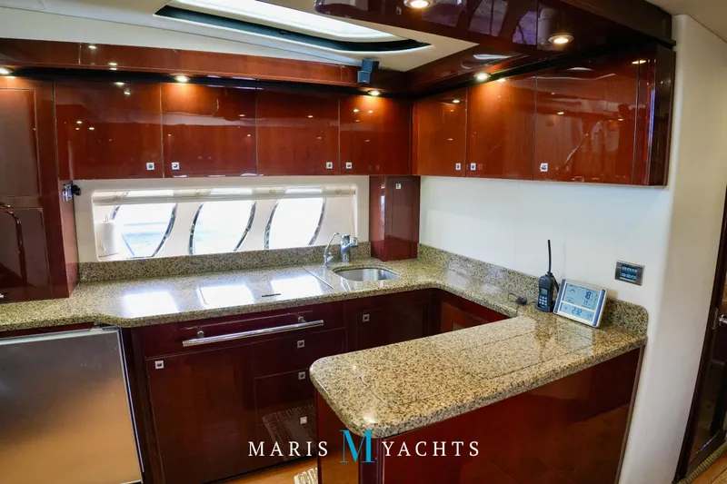Man O War Yacht Photos Pics Luxurious kitchen interior of 2009 Sea Ray 55 Sundancer yacht with granite countertops.