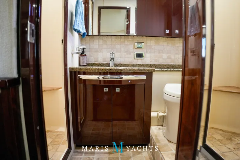 Man O War Yacht Photos Pics Luxurious bathroom interior of 2009 Sea Ray 55 Sundancer yacht with elegant wood finishes.