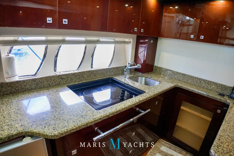 Man O War Yacht Photos Pics Luxurious kitchen interior of 2009 Sea Ray 55 Sundancer yacht with granite countertops.