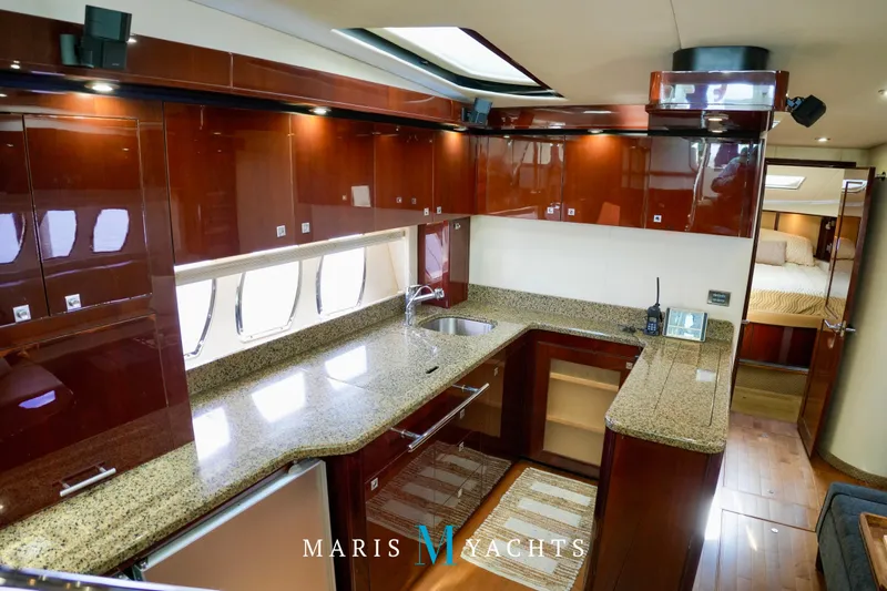 Man O War Yacht Photos Pics Luxurious 2009 Sea Ray 55 Sundancer yacht kitchen with sleek cabinetry and granite countertops.
