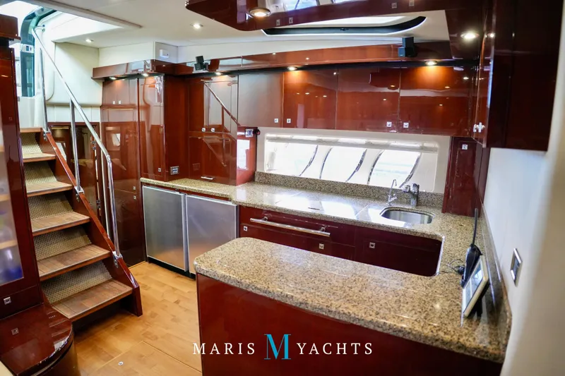 Man O War Yacht Photos Pics Luxurious 2009 Sea Ray 55 Sundancer yacht interior with modern kitchen and elegant wood finishes.