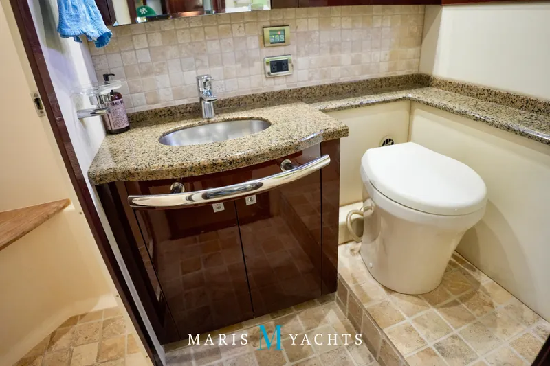 Man O War Yacht Photos Pics Luxurious bathroom in 2009 Sea Ray 55 Sundancer yacht with granite countertop and modern fixtures.