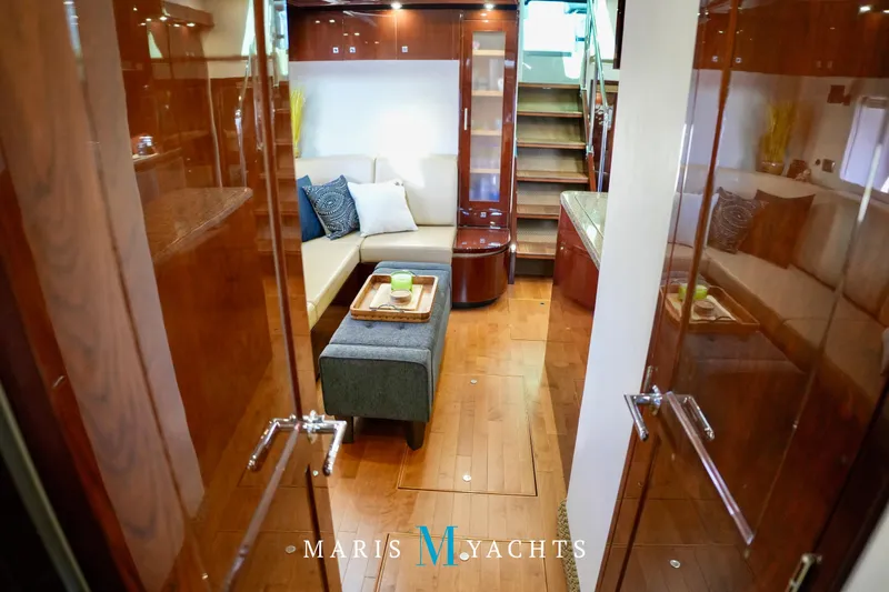 Man O War Yacht Photos Pics Luxurious interior of 2009 Sea Ray 55 Sundancer yacht with elegant wood finishes.
