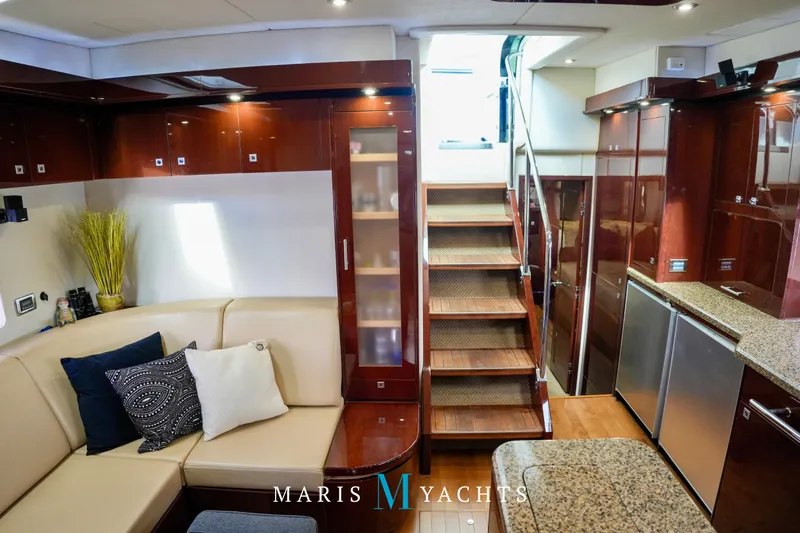 Man O War Yacht Photos Pics Luxurious interior of 2009 Sea Ray 55 Sundancer yacht with elegant wood finishes.