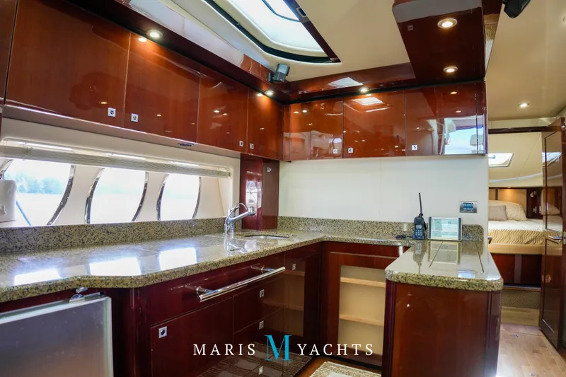 Man O War Yacht Photos Pics Luxurious kitchen interior of 2009 Sea Ray 55 Sundancer yacht with granite countertops.