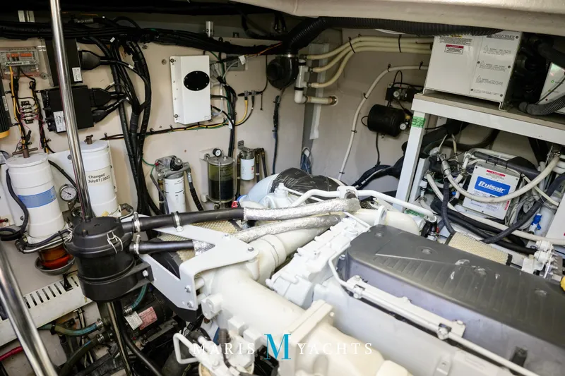 Man O War Yacht Photos Pics Engine room of 2009 Sea Ray 55 Sundancer yacht, showcasing mechanical components and wiring.