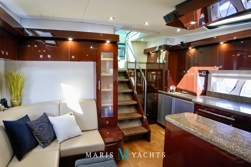 Man O War Yacht Photos Pics Luxurious interior of 2009 Sea Ray 55 Sundancer yacht with modern kitchen and seating area.