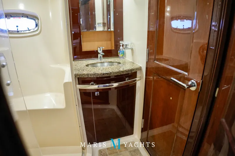 Man O War Yacht Photos Pics Luxurious bathroom in 2009 Sea Ray 55 Sundancer yacht with granite countertop and wooden cabinetry.