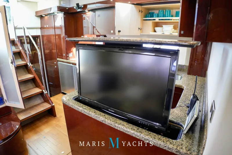 Man O War Yacht Photos Pics 2009 Sea Ray 55 Sundancer yacht interior with TV, stairs, and modern kitchen amenities.