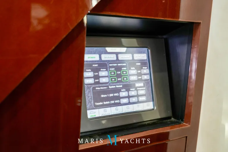 Man O War Yacht Photos Pics Control panel of a 2009 Sea Ray 55 Sundancer yacht, displaying battery and power settings.