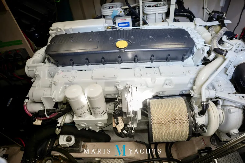 Man O War Yacht Photos Pics Engine room of a 2009 Sea Ray 55 Sundancer yacht, showcasing detailed machinery.