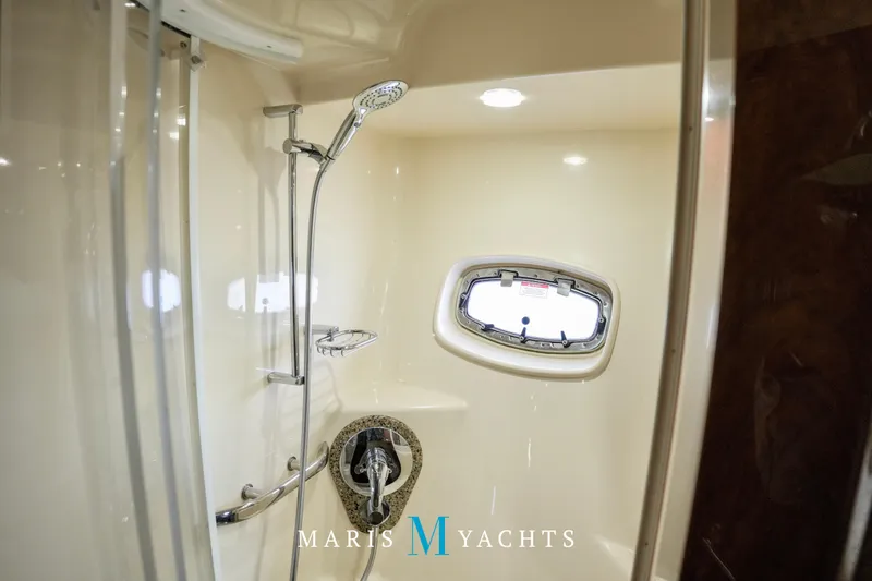 Man O War Yacht Photos Pics Luxurious bathroom interior of 2009 Sea Ray 55 Sundancer yacht with shower and porthole.