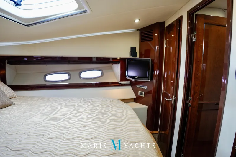 Man O War Yacht Photos Pics Luxurious cabin interior of 2009 Sea Ray 55 Sundancer yacht with elegant wood finishes.