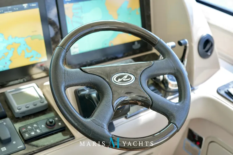 Man O War Yacht Photos Pics Steering wheel and navigation controls of 2009 Sea Ray 55 Sundancer yacht.