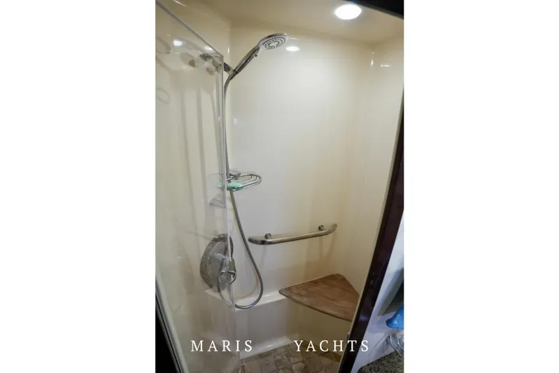 Man O War Yacht Photos Pics Shower area in 2009 Sea Ray 55 Sundancer yacht with modern fixtures and seating.