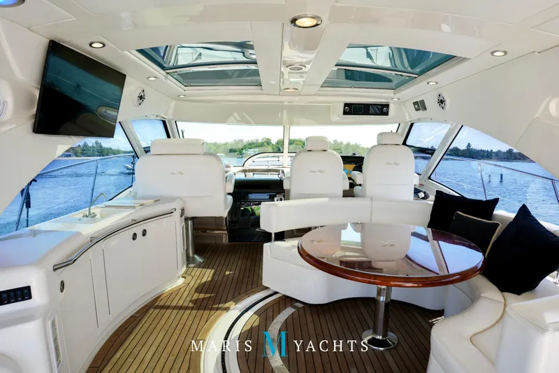 Man O War Yacht Photos Pics Luxurious interior of 2009 Sea Ray 55 Sundancer yacht with elegant seating and panoramic views.