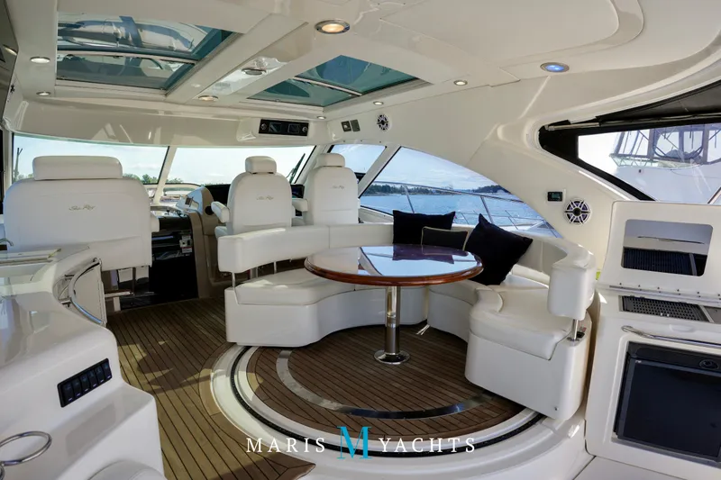Man O War Yacht Photos Pics Luxurious interior of 2009 Sea Ray 55 Sundancer yacht with elegant seating and panoramic windows.