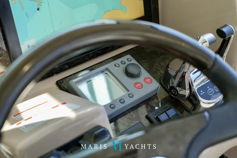 Man O War Yacht Photos Pics Helm of 2009 Sea Ray 55 Sundancer with navigation controls and display.