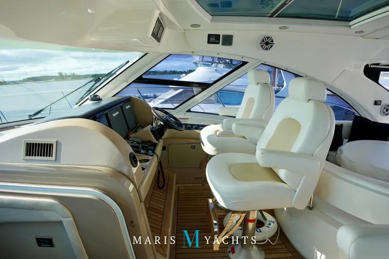 Man O War Yacht Photos Pics Luxurious 2009 Sea Ray 55 Sundancer yacht interior with plush seating and modern controls.