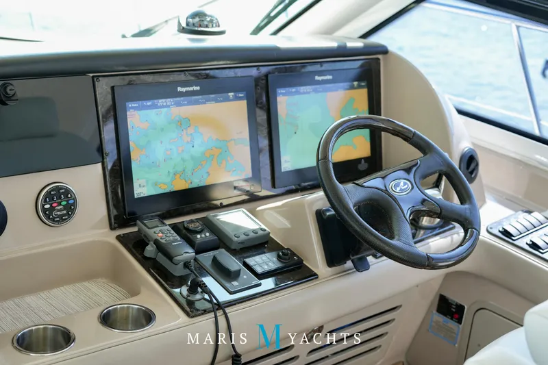 Man O War Yacht Photos Pics 2009 Sea Ray 55 Sundancer helm with dual navigation screens and steering wheel.