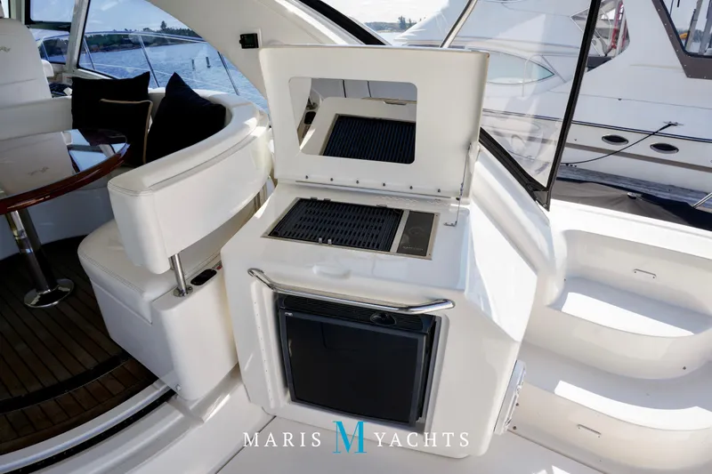 Man O War Yacht Photos Pics 2009 Sea Ray 55 Sundancer yacht interior with grill and seating area.