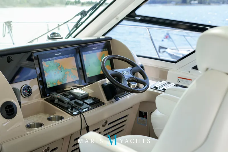 Man O War Yacht Photos Pics Helm of 2009 Sea Ray 55 Sundancer with dual navigation screens and luxurious seating.