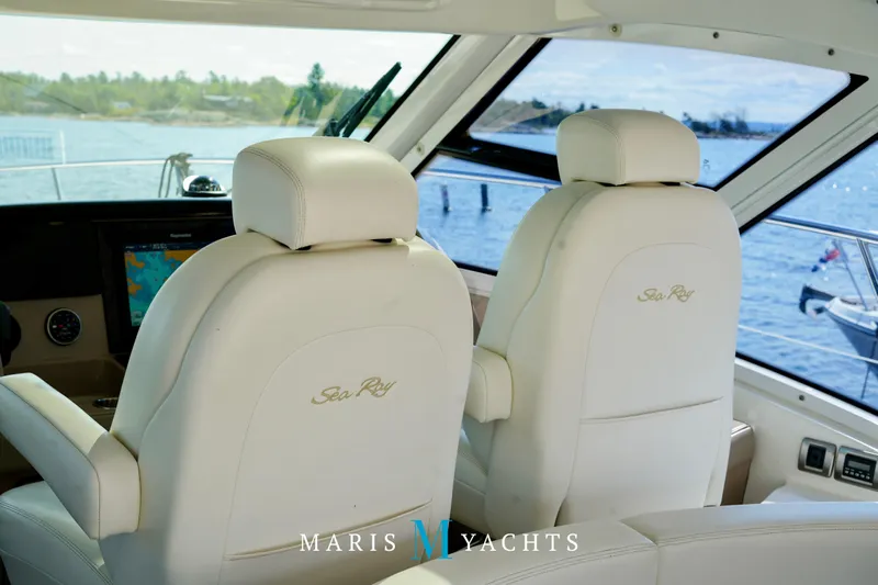 Man O War Yacht Photos Pics Luxurious interior of 2009 Sea Ray 55 Sundancer yacht with plush seating and scenic water view.