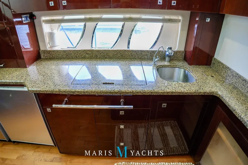 Man O War Yacht Photos Pics Luxurious kitchen interior of 2009 Sea Ray 55 Sundancer yacht with granite countertops.