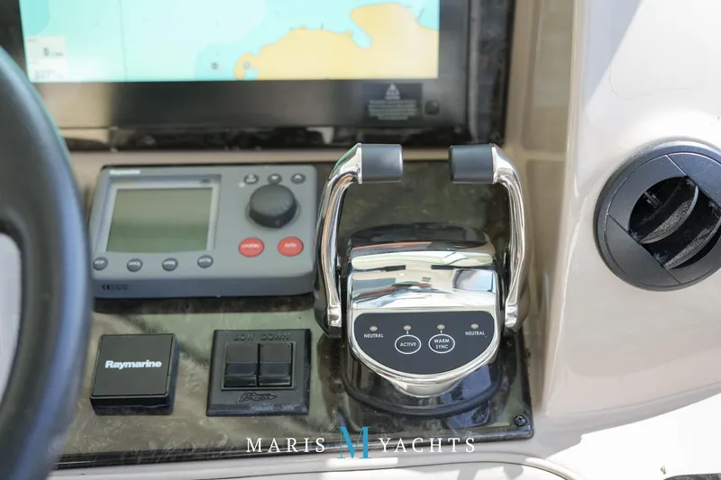 Man O War Yacht Photos Pics Control panel of 2009 Sea Ray 55 Sundancer yacht with navigation and throttle controls.