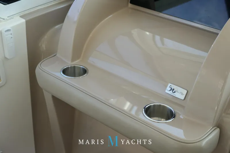 Man O War Yacht Photos Pics 2009 Sea Ray 55 Sundancer yacht interior with cup holders and beige finish.