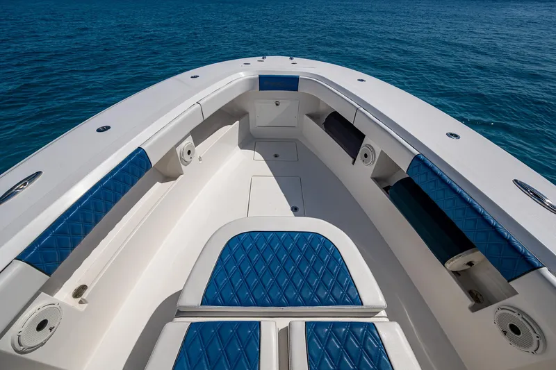  Yacht Photos Pics Front Runner 39 boat interior with blue seating, 2020 model, on clear blue water.