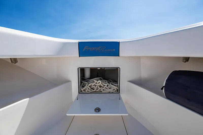  Yacht Photos Pics Front Runner 39 boat storage compartment with rope, 2020 model, under clear blue sky.