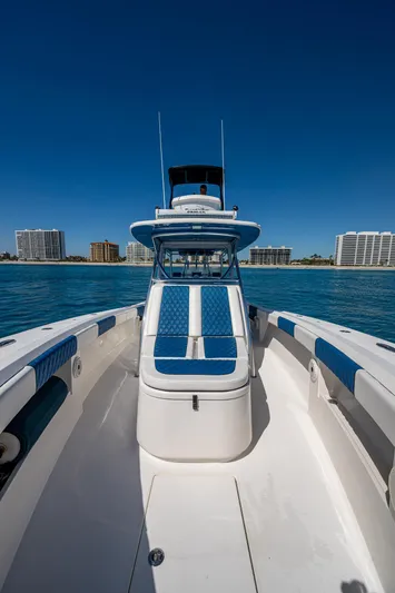  Yacht Photos Pics 2020 Front Runner 39 boat on water with city skyline in background.