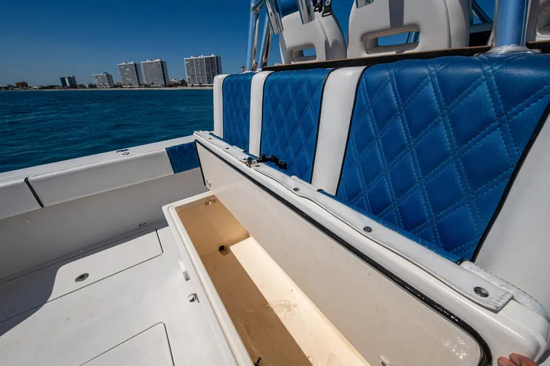  Yacht Photos Pics 2020 Front Runner 39 boat interior with blue seating and open storage compartment.