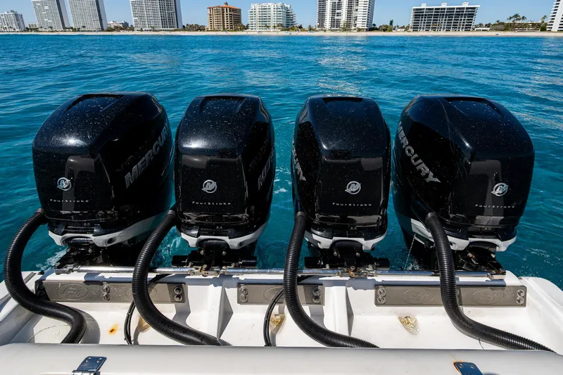  Yacht Photos Pics Four Mercury outboard engines on a 2020 Front Runner 39 boat, with city skyline in background.