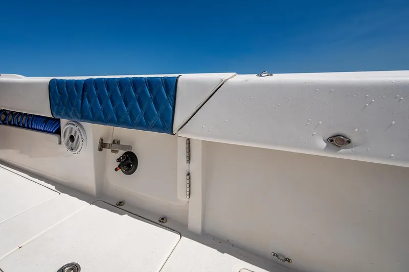  Yacht Photos Pics 2020 Front Runner 39 boat interior with blue cushioned seating and white deck.