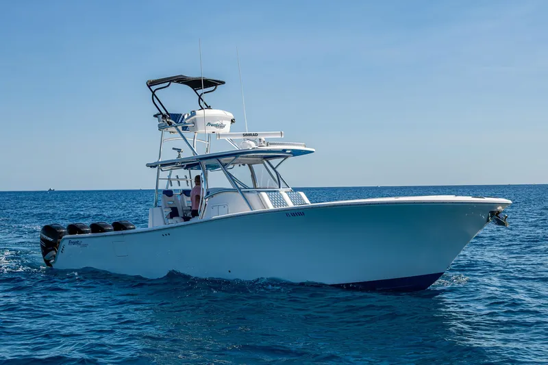  Yacht Photos Pics 2020 Front Runner 39 boat cruising on open sea under clear blue sky.