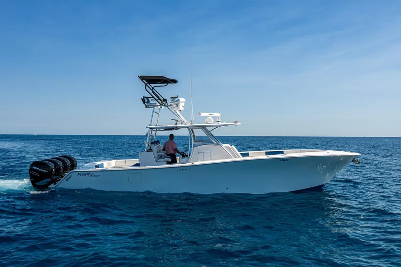  Yacht Photos Pics 2020 Front Runner 39 boat cruising on open sea with clear blue skies.