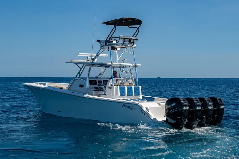  Yacht Photos Pics 2020 Front Runner 39 boat with multiple outboard motors cruising on open water.