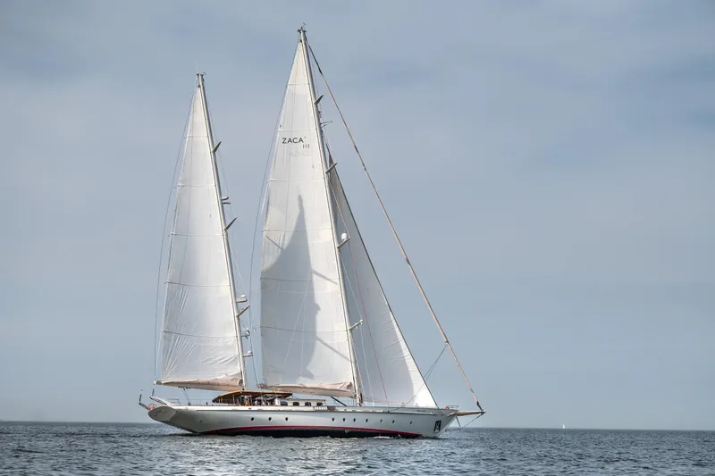 Melody Yacht Photos Pics Sailing yacht on open sea, Ridas Custom Yacht 2022, with white sails and clear sky.