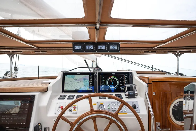 Melody Yacht Photos Pics Luxurious 2022 Ridas Custom Yacht cockpit with advanced navigation systems and wooden steering wheel.